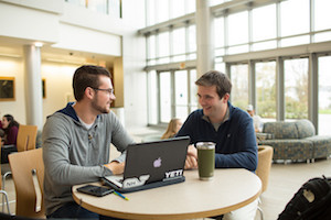 Students talking at table